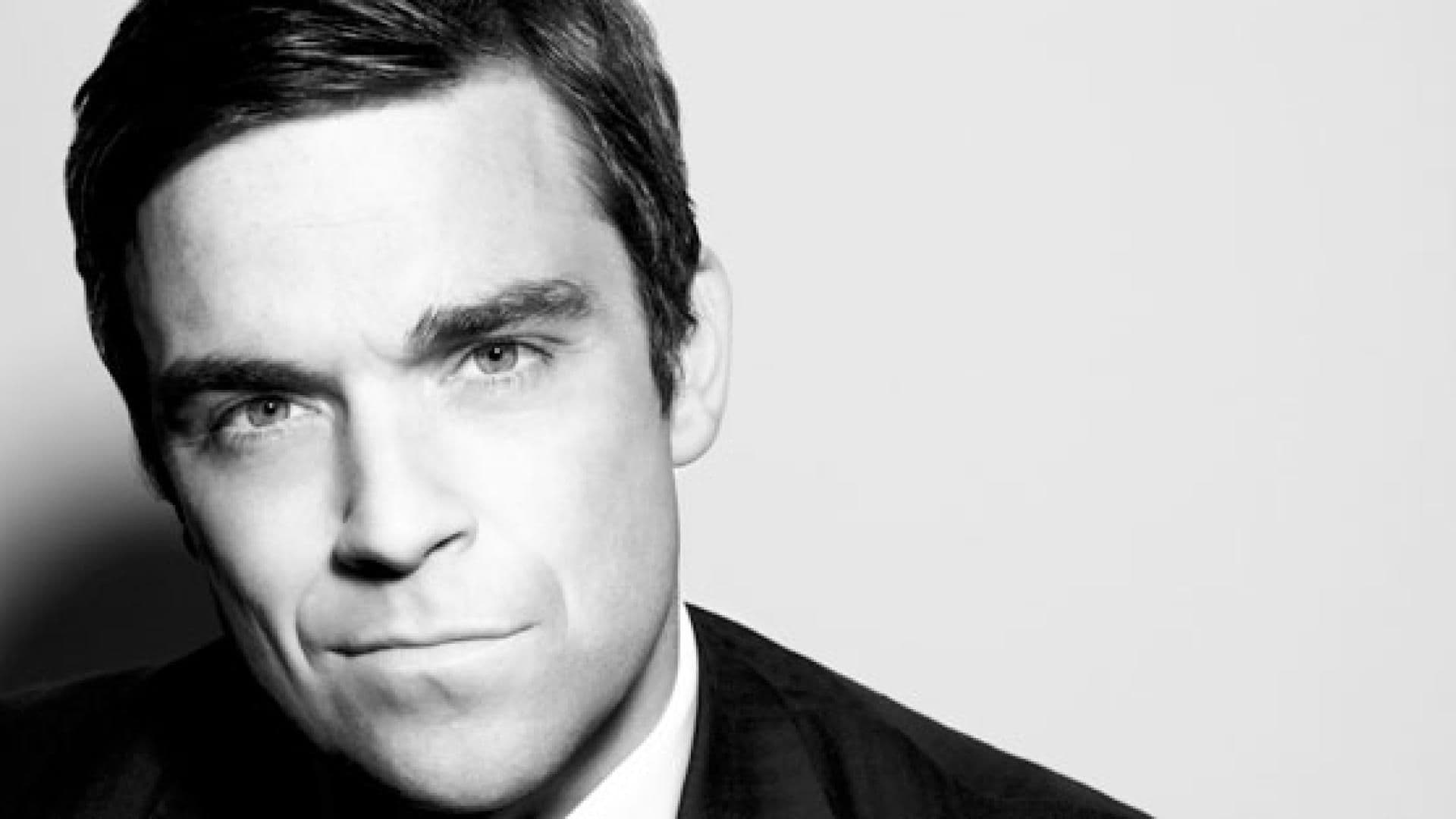 robbie-williams-foto-julian-broad-557x313-521482.jpg