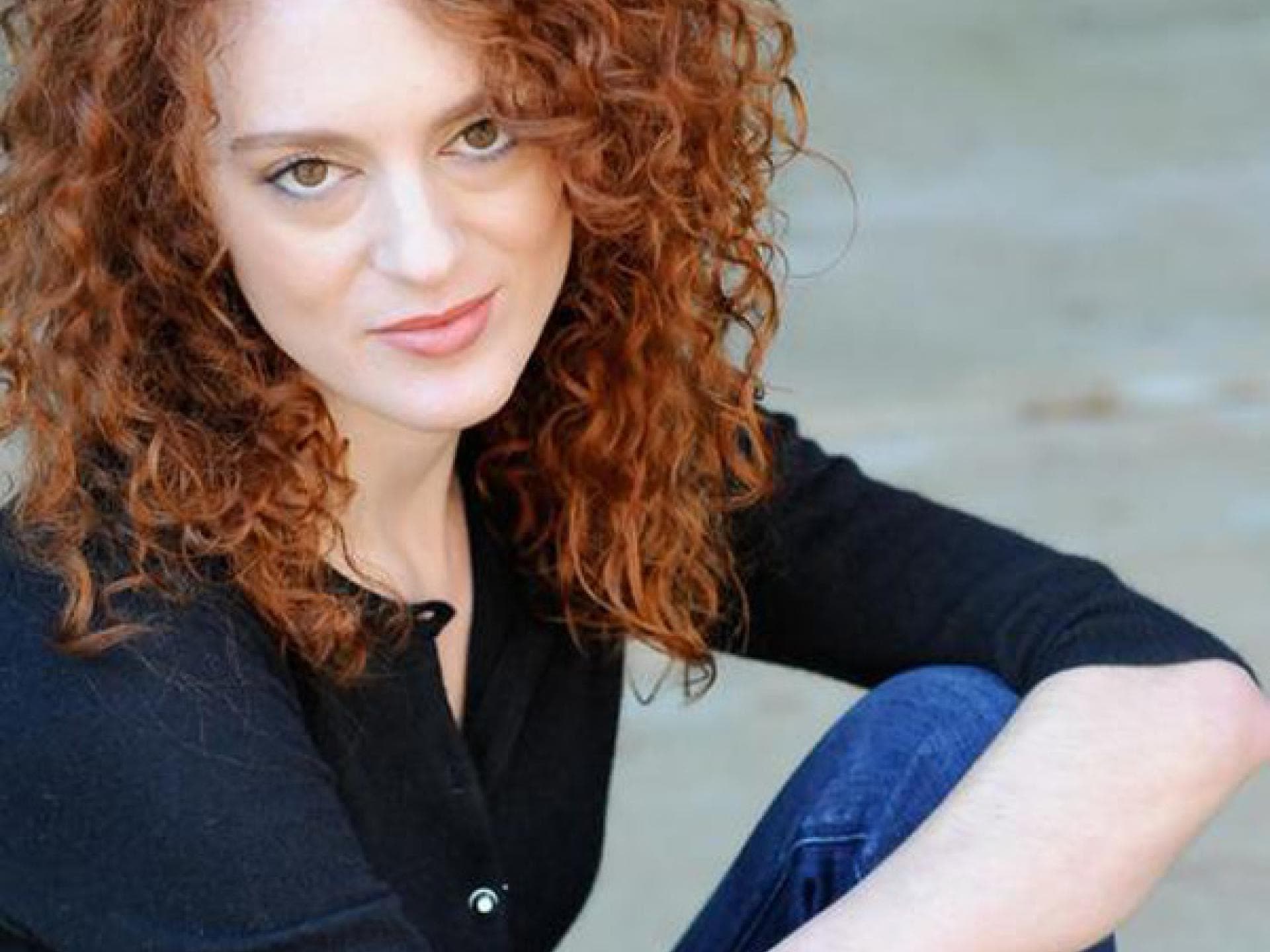 Amber Chaney als Avox-Mädchen (Lavinia)